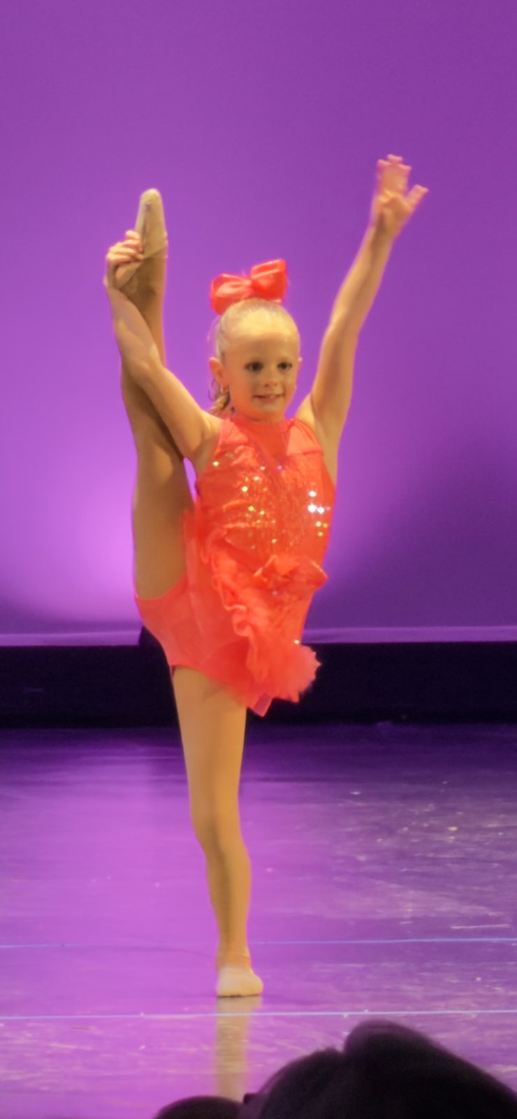 A young Project Dance recreation dancer performing a solo on stage